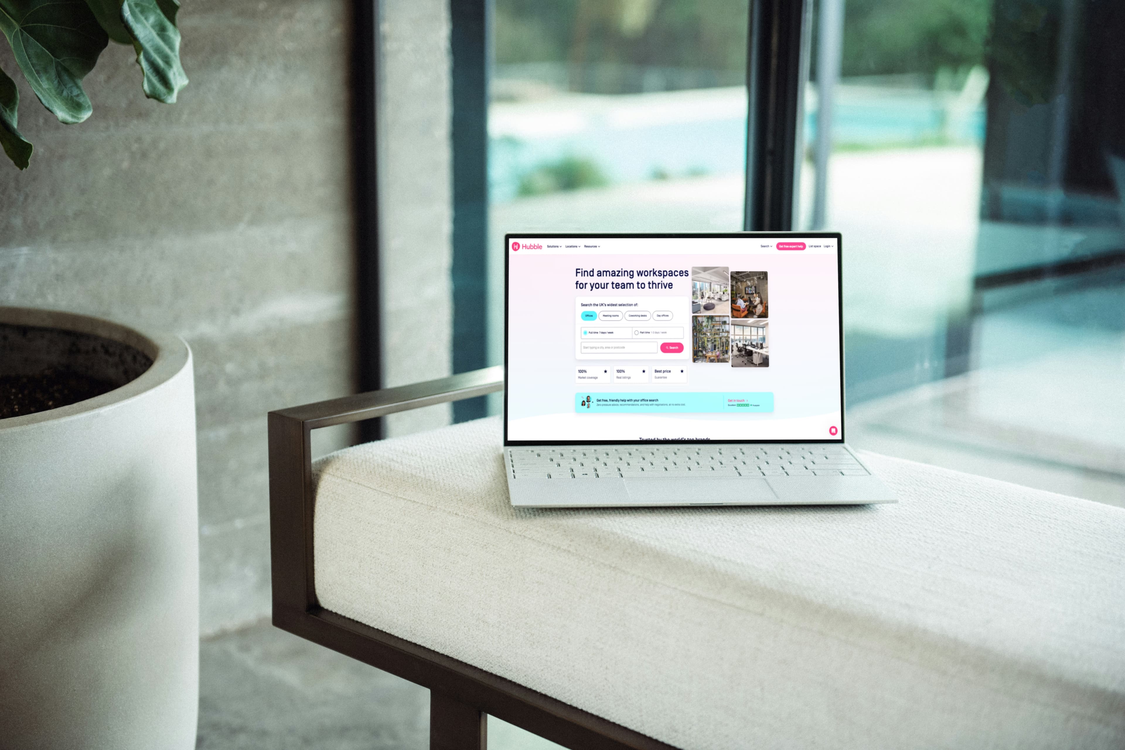 A laptop on a cushioned bench shows Hubble's website, featuring a search tool to find workspaces according to location and other preferences, along with a tagline: "Find amazing workspaces for your team to thrive."